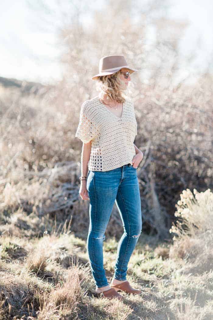 Made from two simple rectangles, this poncho-style summer crochet top will give your outfits a boho vibe all season. Free crochet pattern using the Iris Stitch and the Boxed Shell Stitch, featuring Lion Brand Yarn LB Collection Cotton Bamboo. 