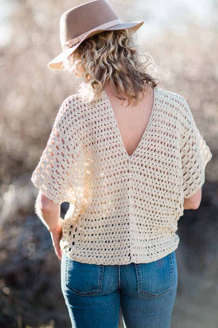 Made from two simple rectangles, this poncho-style summer crochet top with an open back will give your outfits a boho vibe all season. Free crochet pattern using the Iris Stitch and the Boxed Shell Stitch, featuring Lion Brand Yarn LB Collection Cotton Bamboo. 