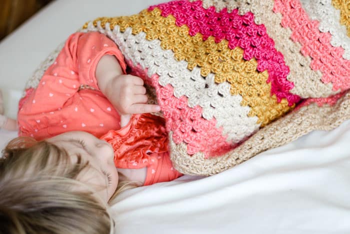 Free baby girl crochet blanket pattern that can be made with Lion Brand Heartland yarn. Very easy to modify for a boy too!