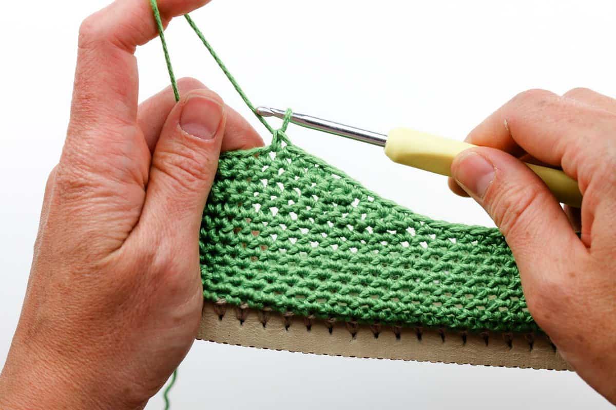 Learn how to crochet your own functional shoes by using Lion Brand 24/7 Cotton yarn and flip flop soles. Free pattern and photo tutorial (with some video) from Make and Do Crew.