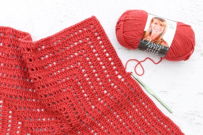 Free crochet hexagon sweater pattern and video tutorial featuring Lion Brand Vanna's Style yarn in "tomato."