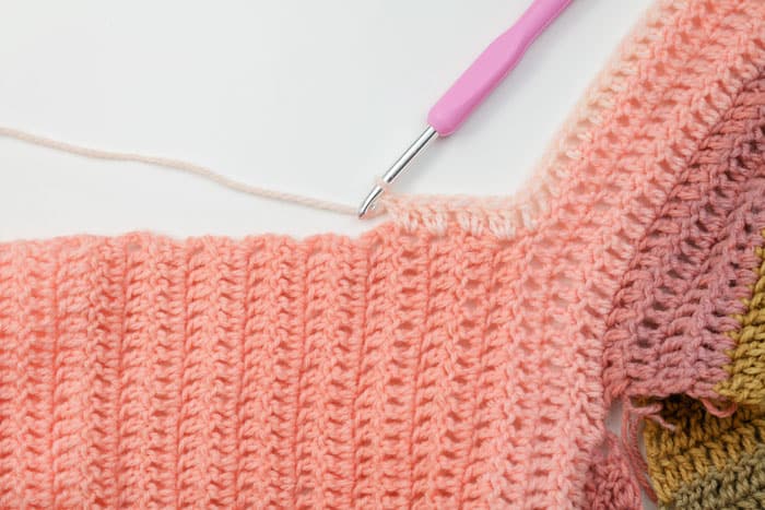 How to add a border to a crochet cardigan with pockets.