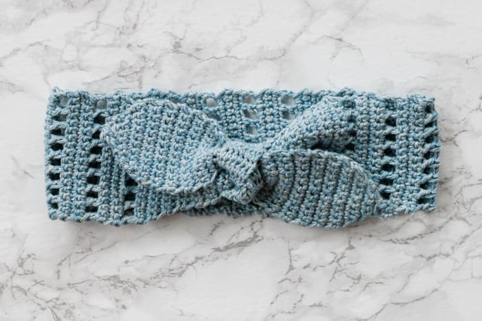 Whether you’re a vintage-loving gal or boho queen, this summer crochet knot headband will let you skip a shampoo and look gorgeous doing it. Made with LB Collection Cotton Jeans yarn.