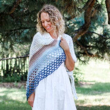 This beautiful crochet shawl pattern is made from an asymmetrical triangle using puff stitches and easy lace. Great crochet scarf pattern to use Lion Brand Mandala, Caron Cakes or Sweet Rolls.