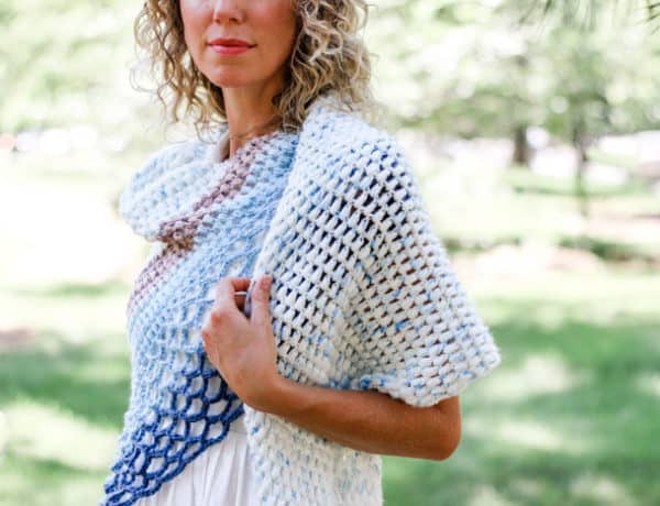 This easy asymmetrical crochet shawl pattern is made from simple puff stitches and lace. Featuring Lion Brand Ice Cream and Mandala yarn.