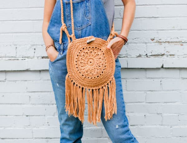 This easy crochet hippie purse pattern is made from Lion Brand 24/7 Cotton yarn and two simple circles. Great bag for adding boho style to your handmade wardrobe.