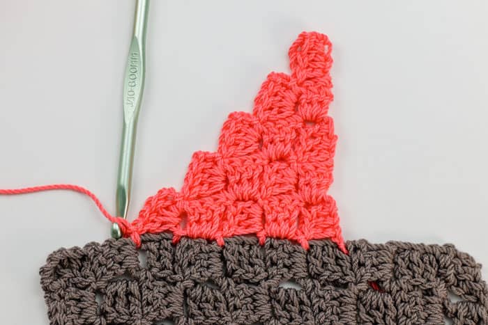 In this video tutorial, learn how to join corner-to-corner crochet pieces together without a visual seam (and with no actual sewing!) This method will help you piece together squares and rectangles to make more complex shapes (like sweaters) or simply allow you to seamlessly join C2C crochet afghan squares.