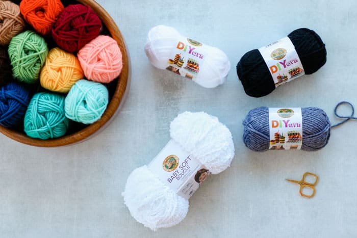 Lion Brand Baby Soft Boucle Yarn in white and DIYarn, which is the best yarn for crochet amigurumi.