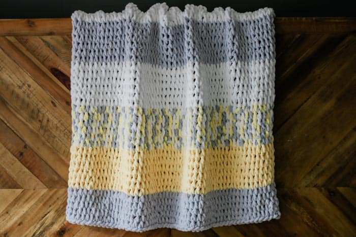Made with Lion Brand Off the Hook loop yarn and a very simple technique, this finger knitting blanket is a breeze to "knit," even for absolute beginners. Perfect size couch throw or baby blanket. Free video tutorial and pattern.