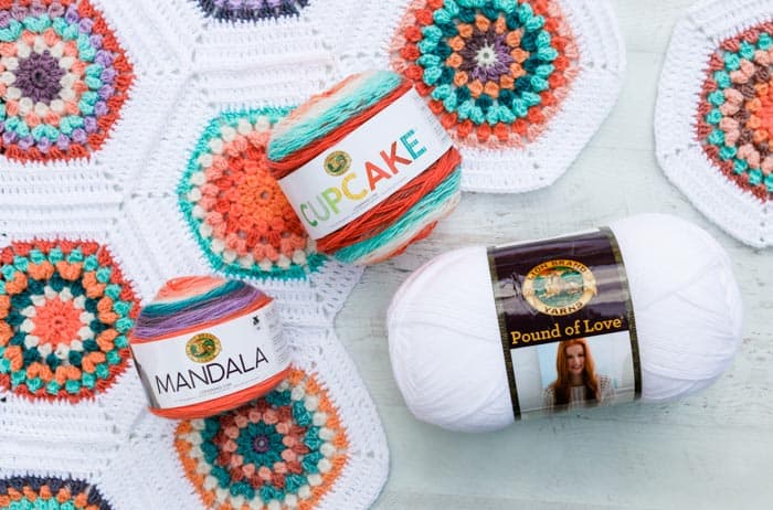 Use Lion Brand Mandala cake yarn or yarn scraps to make this vintage-inspired crochet hexagon blanket. Customize to any size you wish! Free pattern + video tutorial using Lion Brand Mandala, Cupcake and Pound of Love yarn.