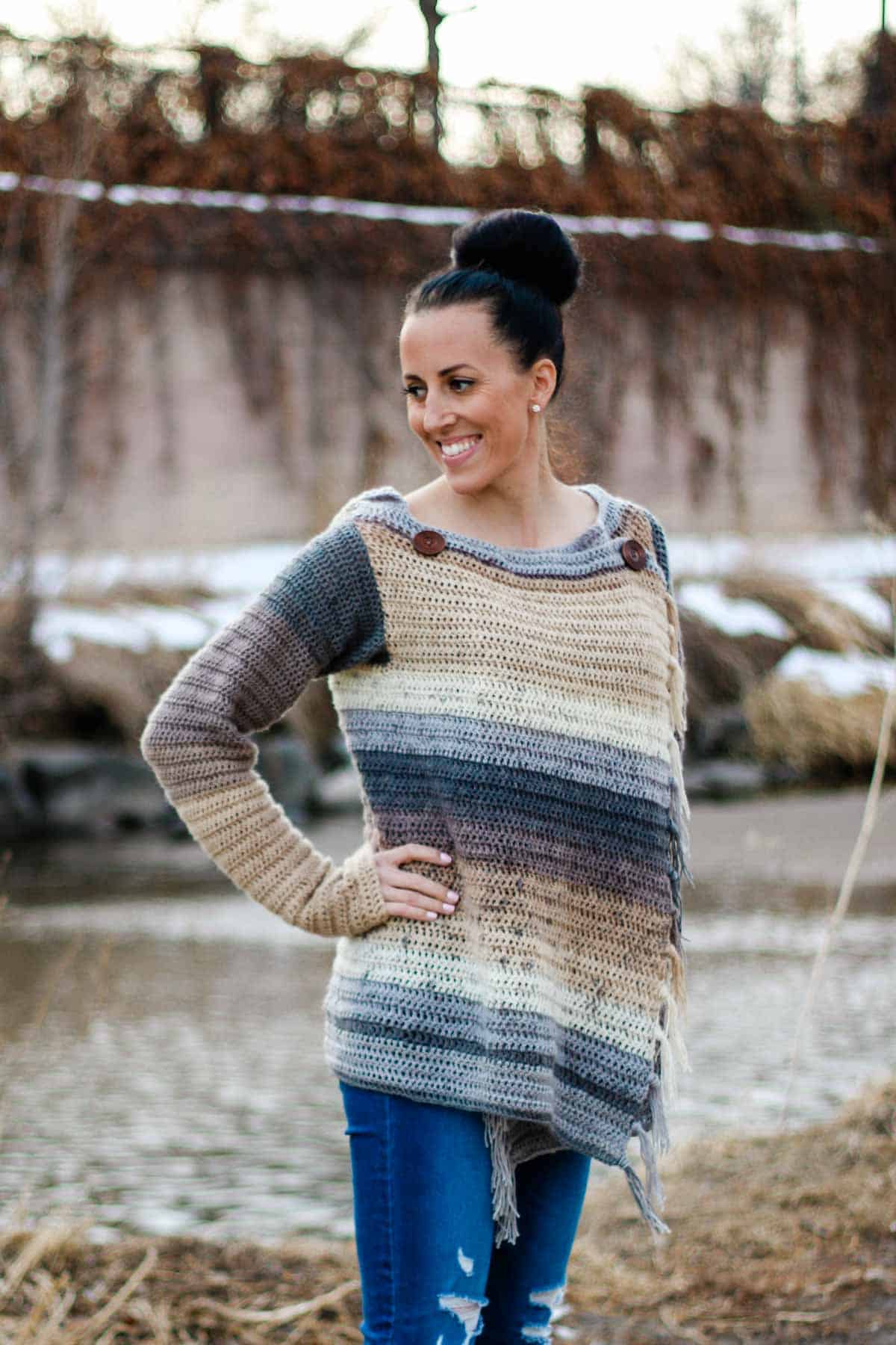 This crochet blanket sweater can button in front to create the look of a pullover or be worn open like a cardigan. Free pattern and tutorial.