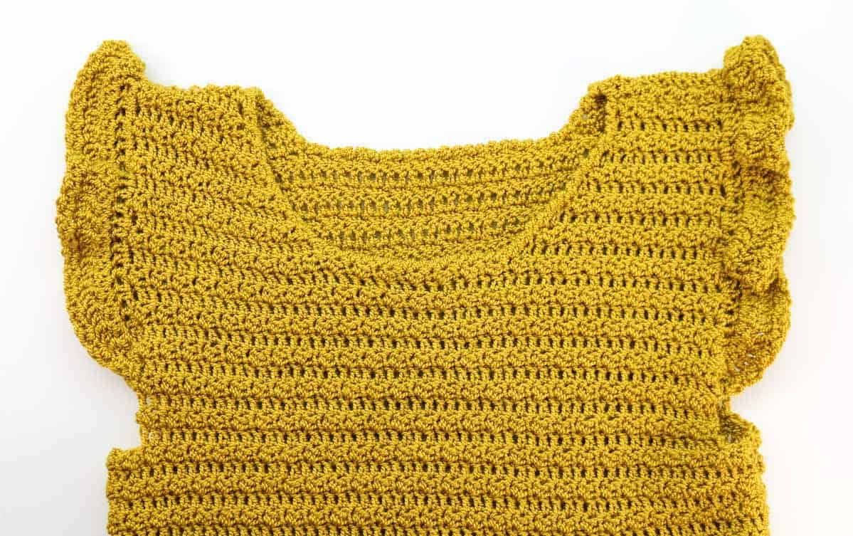 Close-up of flutter sleeve option in Idlewild Dress crochet pattern.