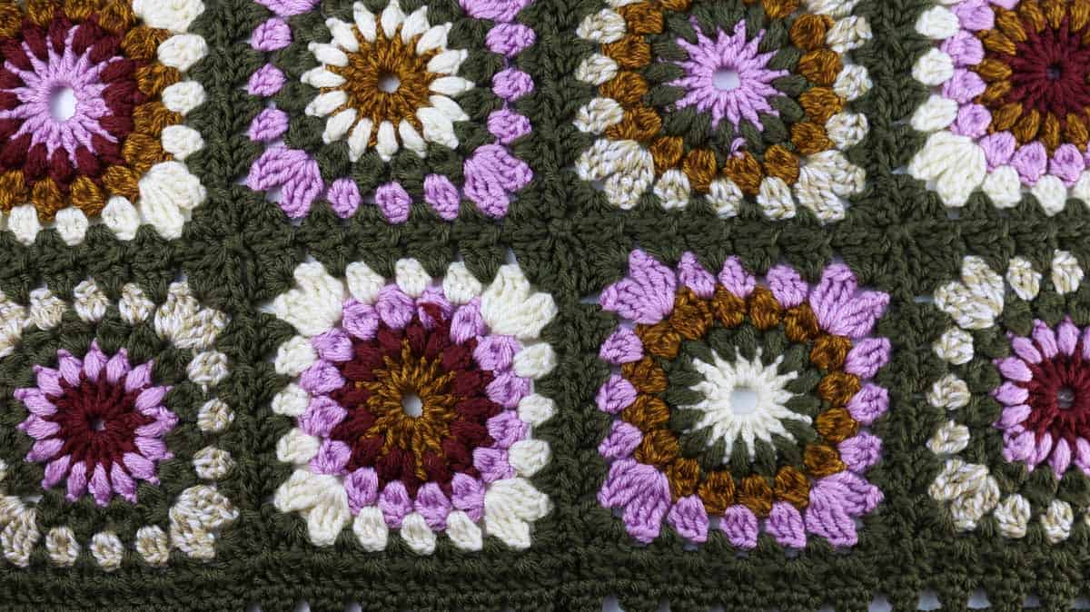 Beautiful modern, sunburst granny squares joined together using a join as you go technique.