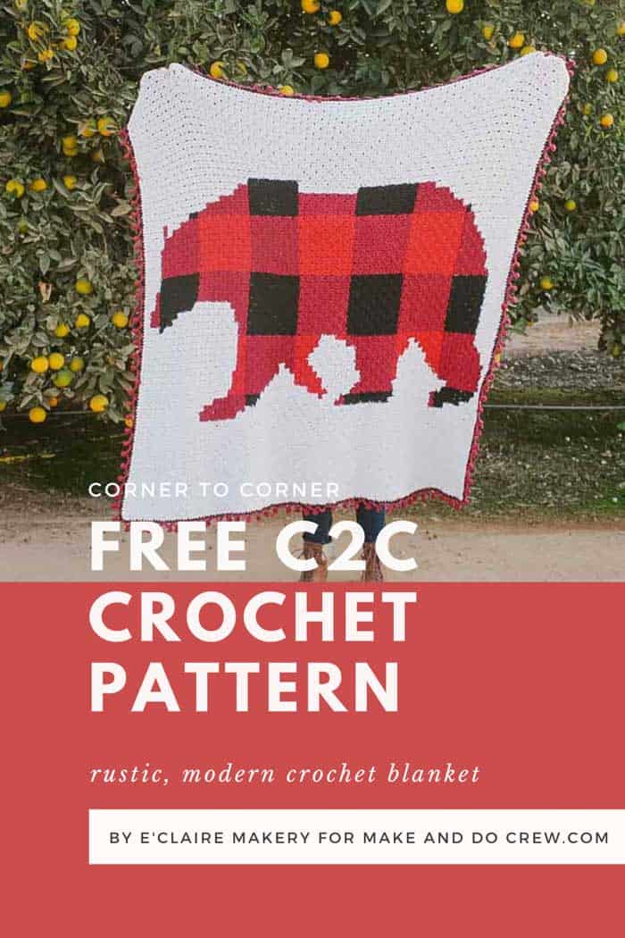 Woman holding a corner to corner crochet bear blanket made with red and black buffalo plaid in Lion Brand Feels Like Butta yarn.
