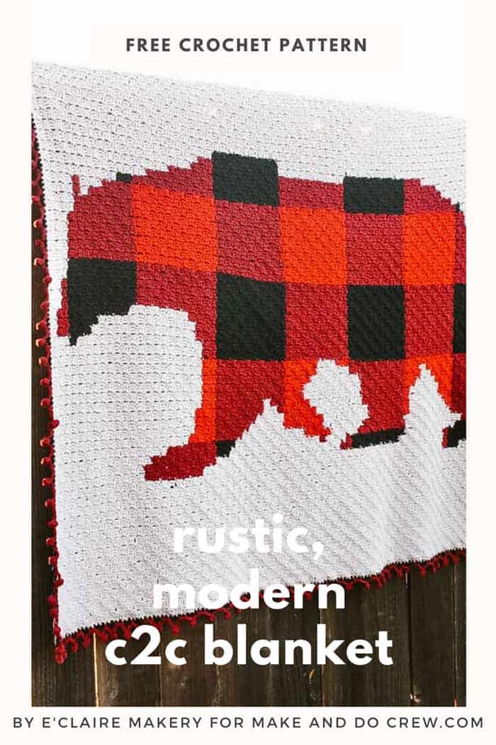 A corner to corner crochet bear baby blanket made with red and black buffalo plaid in Lion Brand Feels Like Butta yarn.