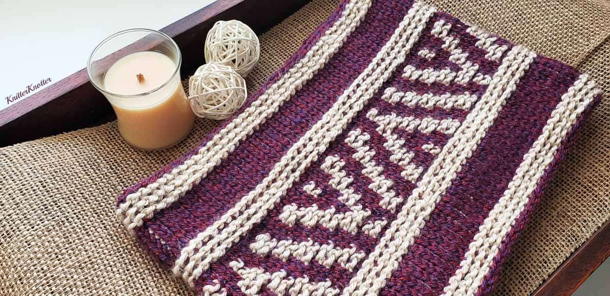 Beginner Tunisian crochet cowl free pattern. Purple and gray yarn and basic Tunisian stitches create a unique color work pattern.