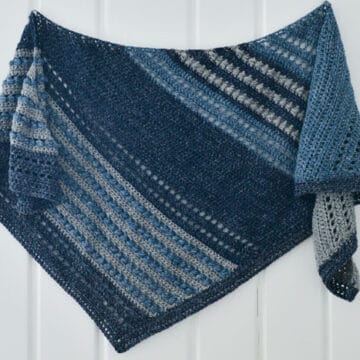 This asymmetrical scarf is made with Lion Brand Jeans yarn using the horizontal puff stitch, creating a unique texture and beautiful drape. Free pattern and tutorial.