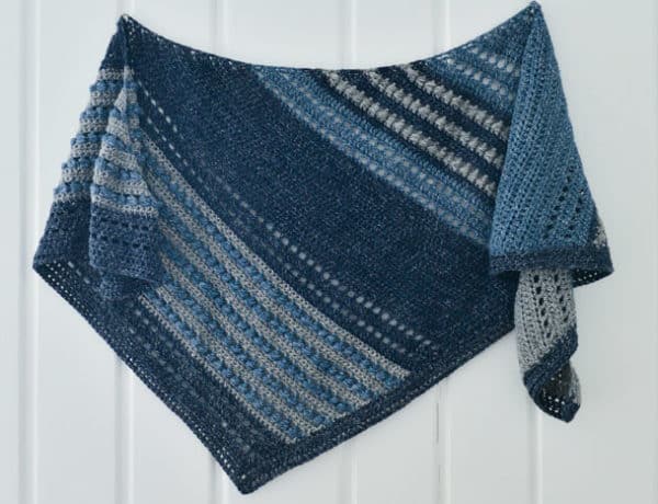 This asymmetrical scarf is made with Lion Brand Jeans yarn using the horizontal puff stitch, creating a unique texture and beautiful drape. Free pattern and tutorial.