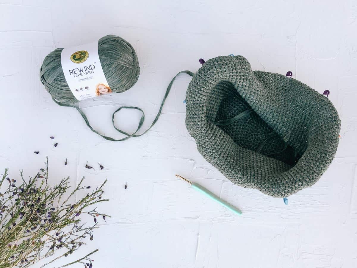 Work in progress crochet sun hat being made with Lion Brand Rewind yarn in the color "Olive You."