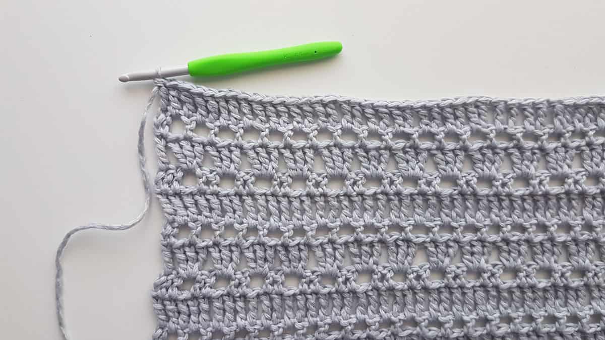 Close up photo of an easy lace crochet stitch. 