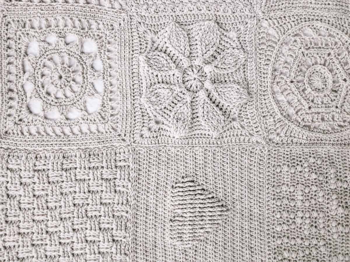 Close up photo of a crochet sampler blanket made with Lion Brand Wool Ease yarn.