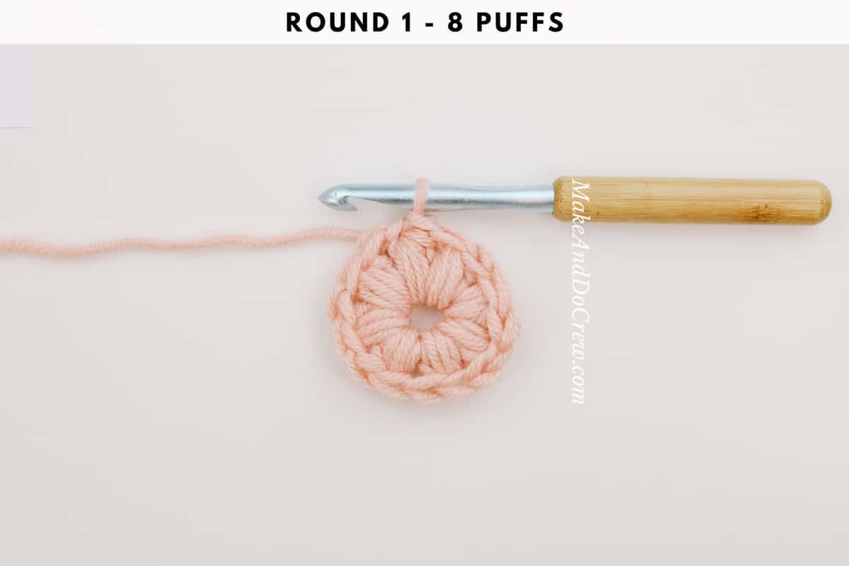 Round 1 of a crochet puff stitch circle.