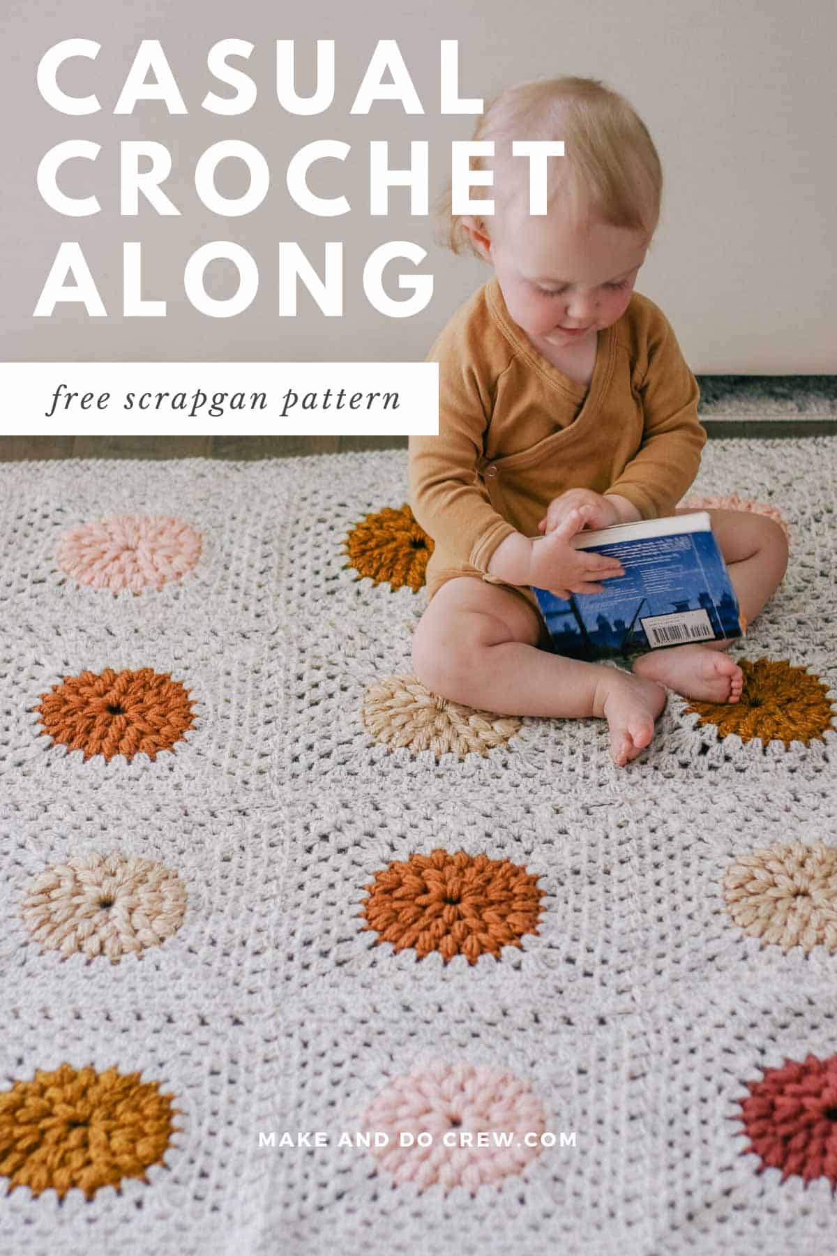 Baby sitting on a modern crochet granny square blanket made with Lion Brand Wool Ease yarn scraps.