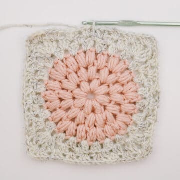 Unique crochet granny square made from puff stitches and regular granny stitches.