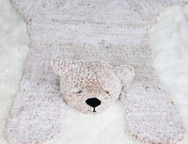 A crocheted faux fur bear rug made from Lion Brand Go for Faux in the color Blonde Elk.