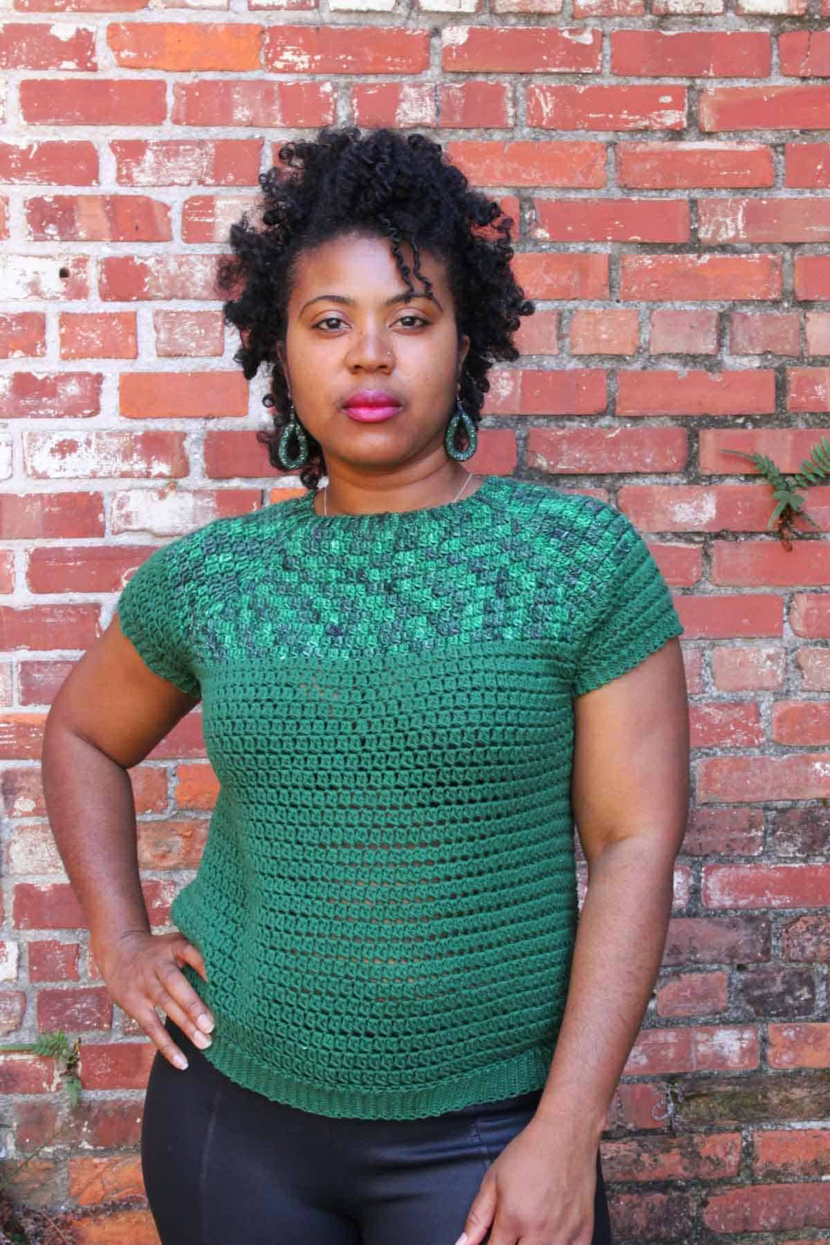 Nkese Lewis, pictured here wearing a green crochet summer top, provides tips on how to become a crochet pattern tester.