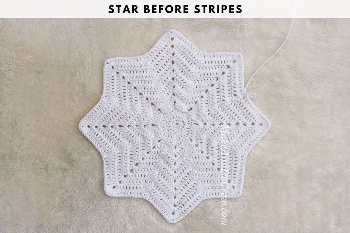 Crochet photo tutorial image showing a white crochet 8 point star before stripes are added.