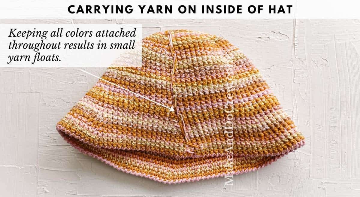 A handmade crochet bucket hat turned inside out, revealing the yarn floats that result from carrying colors.