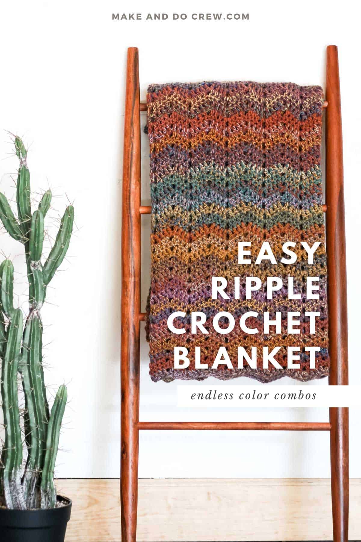 A wooden ladder leaning on a white wall with a crochet blanket hanging on it.