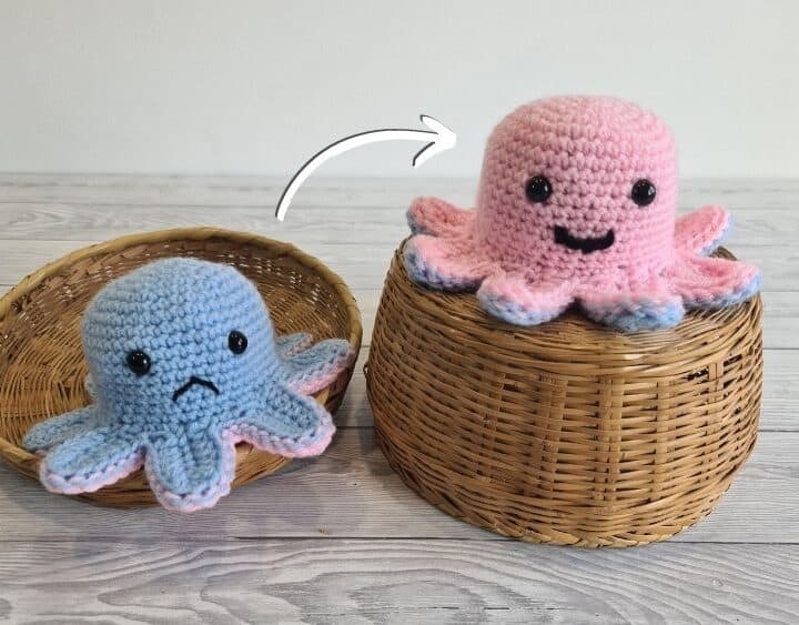 Two reversible crochet octopus mood toys on top of a wicker basket.