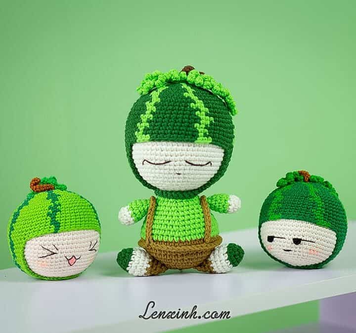 Three crochet watermelon amigurumi dolls.