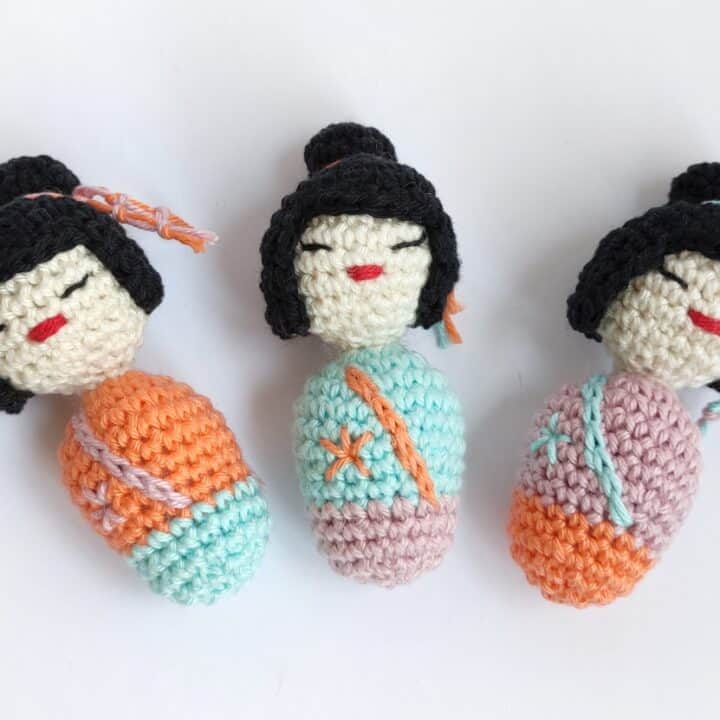 Three crochet kokeshi amigurumi dolls.
