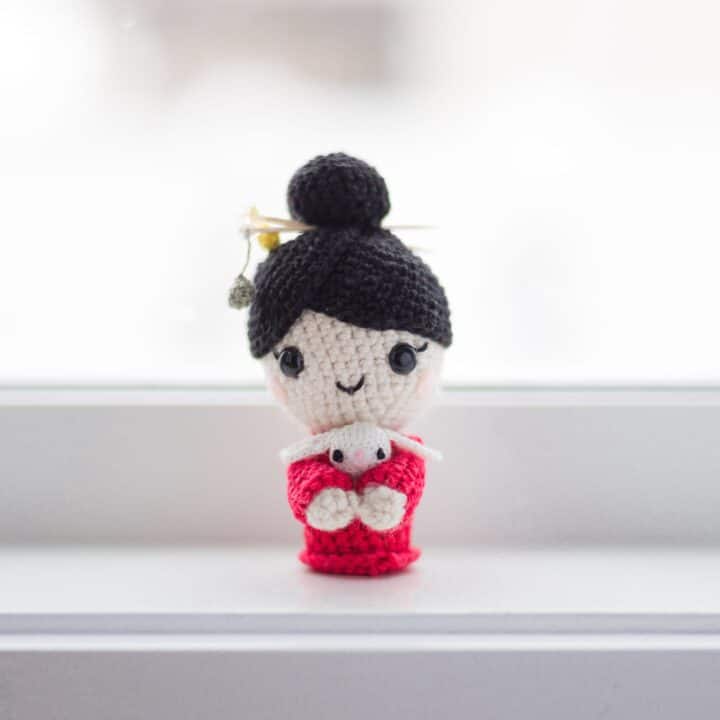 A mini Chinese new year amigurumi doll.