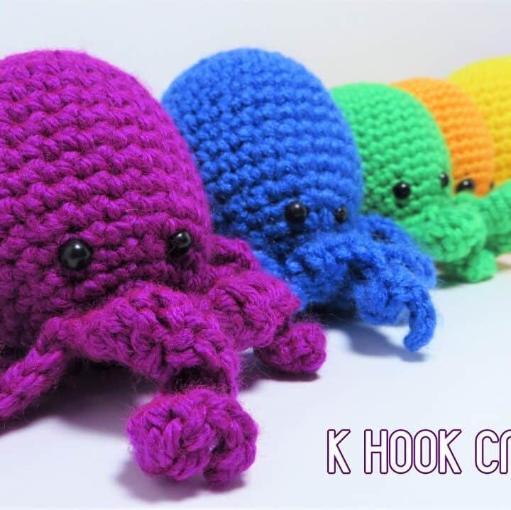 6 different colored crochet octopus amigurumi.