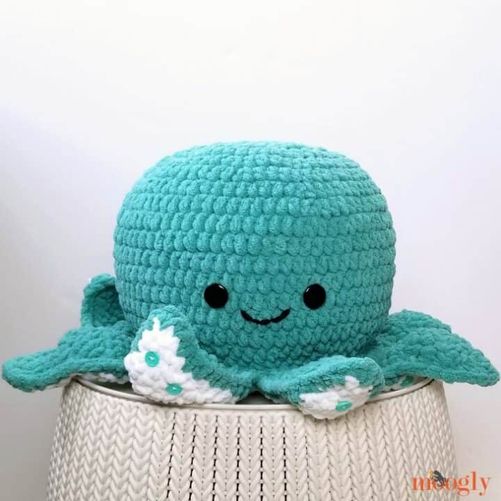 A large blue octopus toy on top of a table.