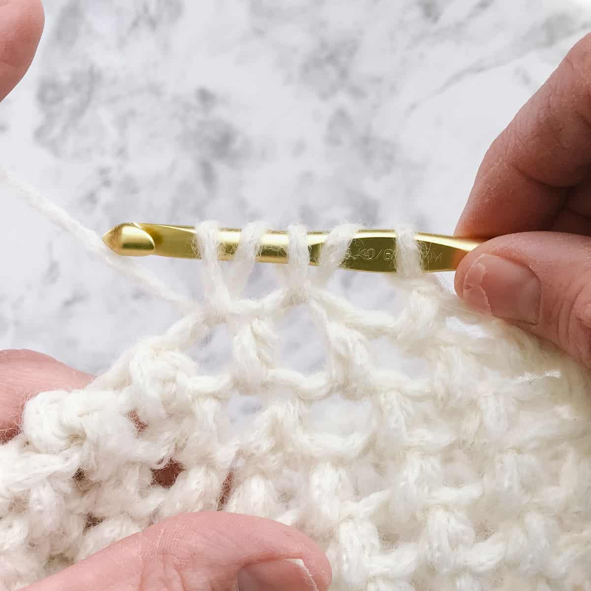 An in-progress puff stitch crochet tam hat tutorial.