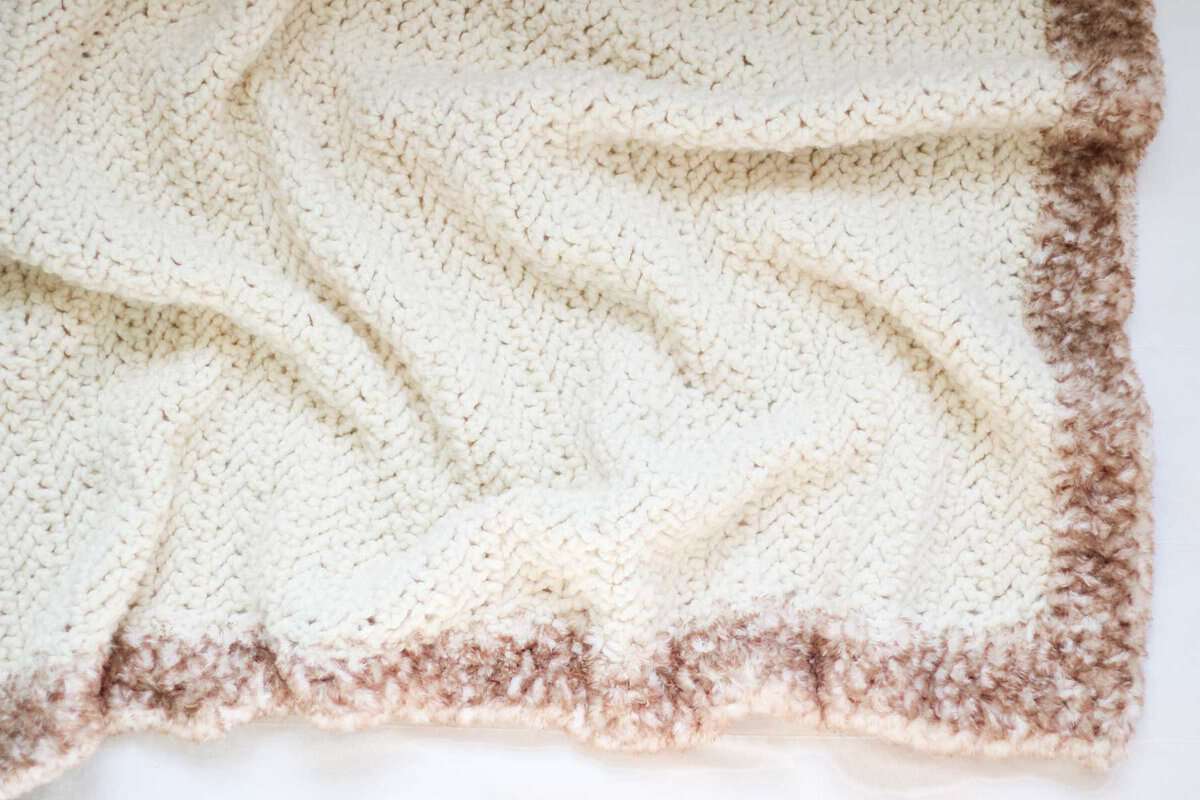 The faux fur border on a simple crochet blanket.