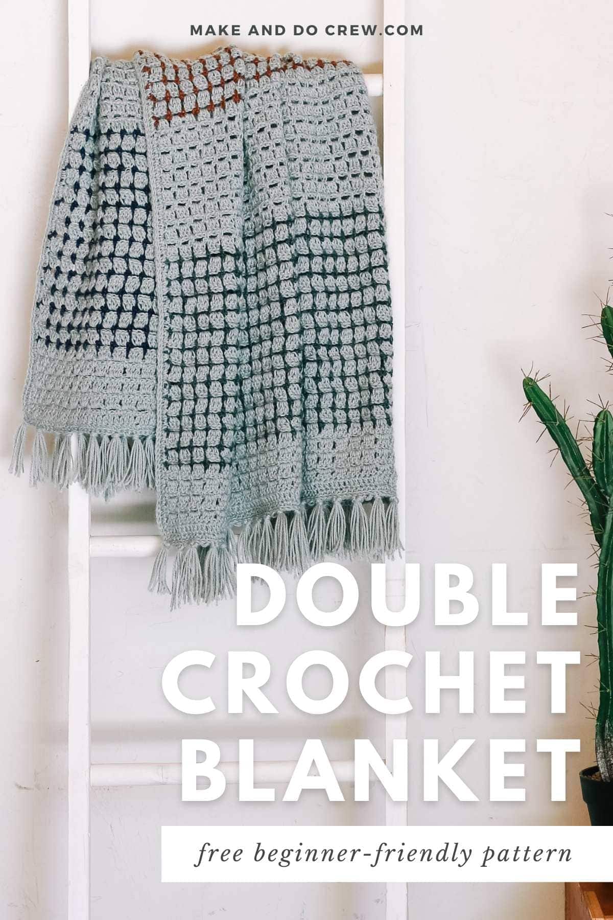 Double crochet blanket draped on a wooden stairs crochet pattern.