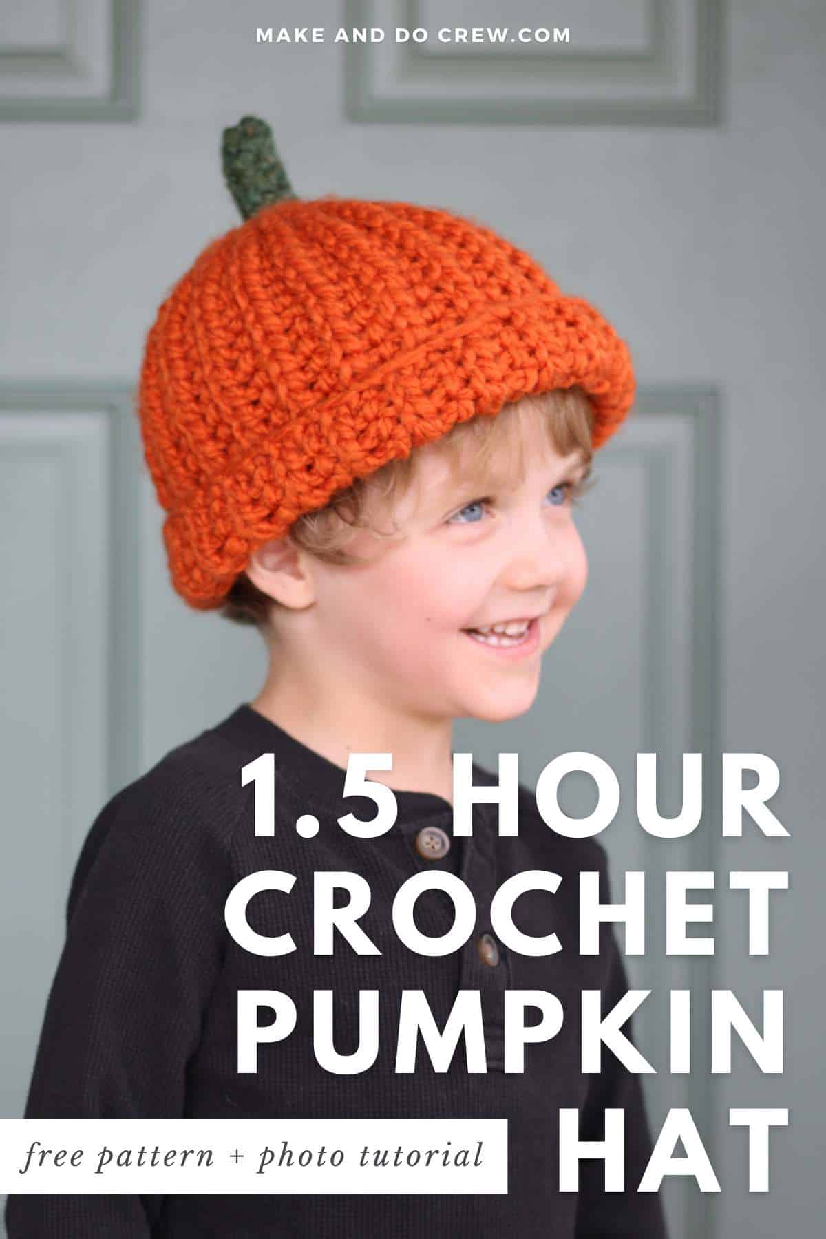 Young child wearing a pumpkin crochet beanie hat.
