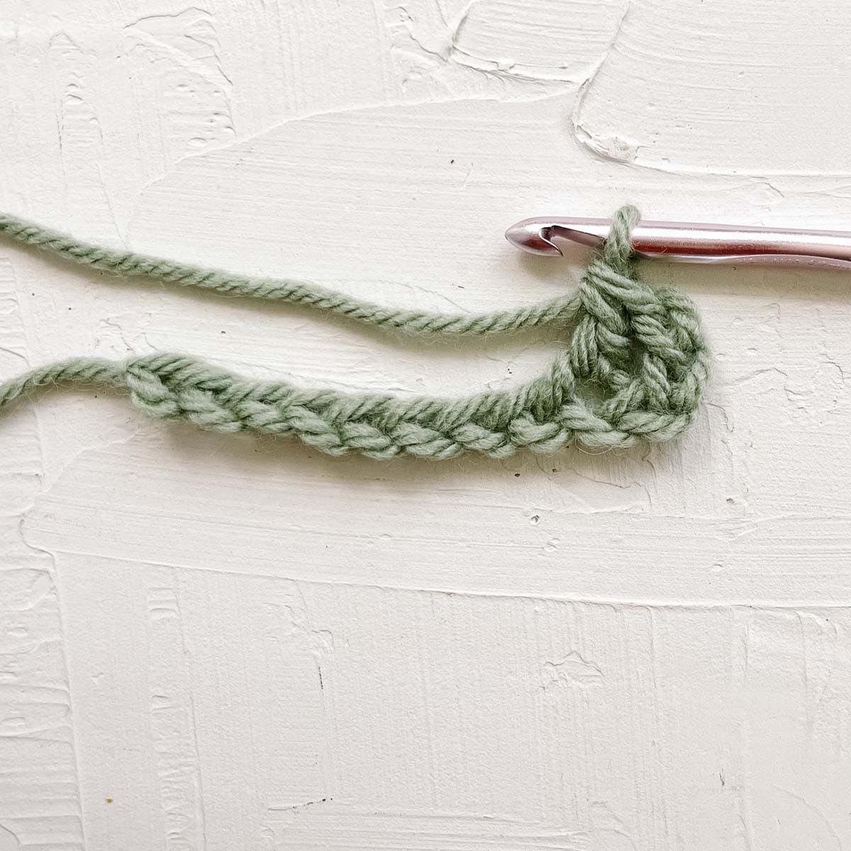 Double crochet step 4: Yarn over and pull through final two loops on hook.
