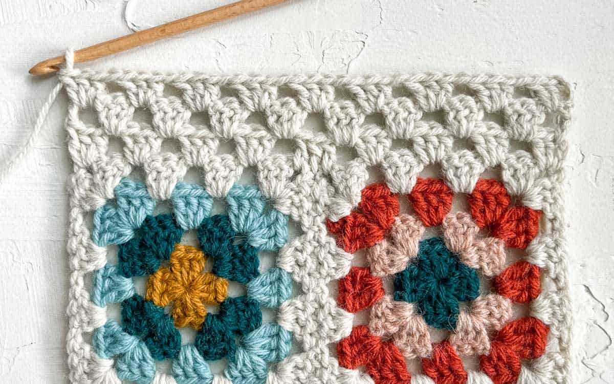 Tutorial showing how to crochet the third row of granny stitch.