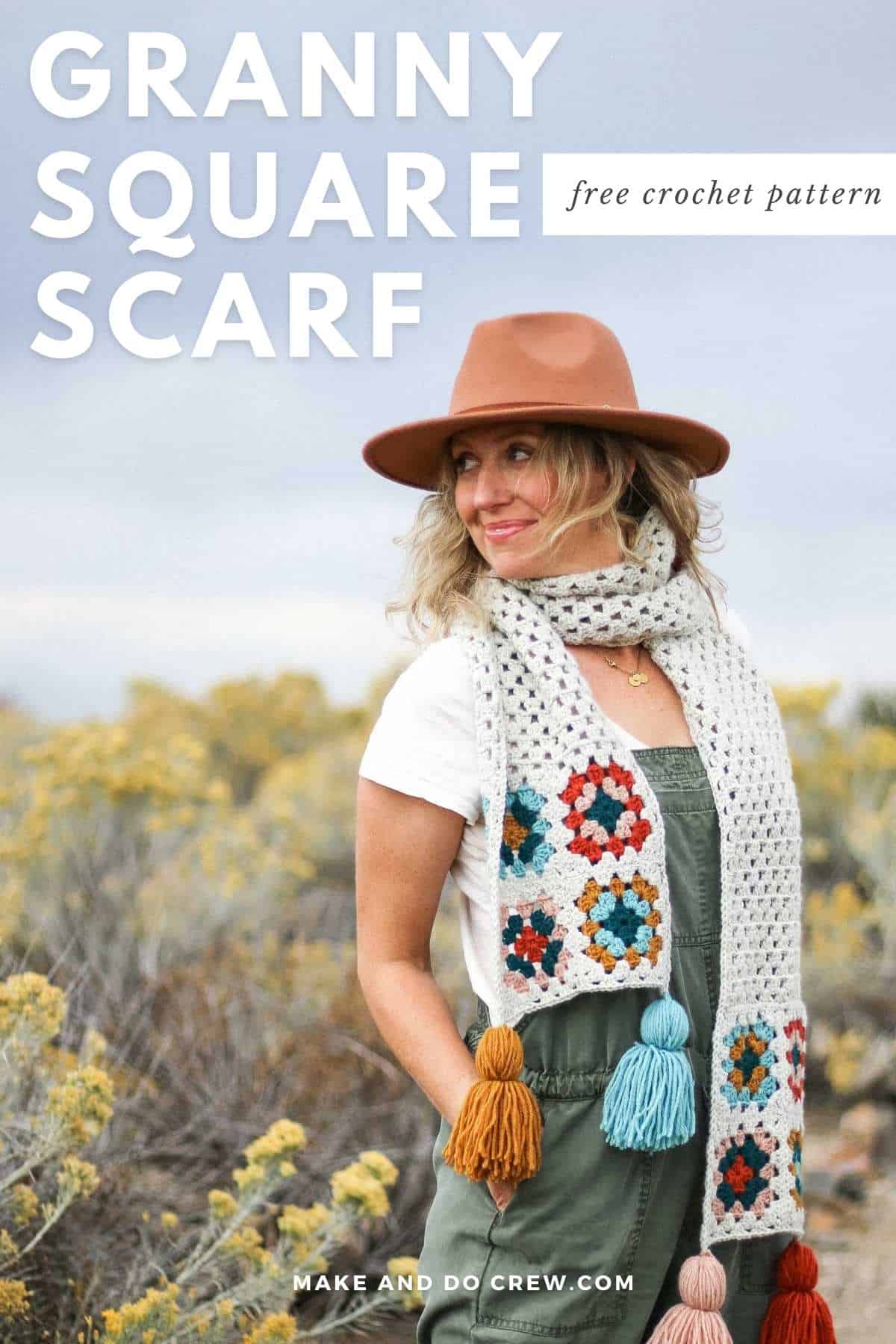 A woman wearing a crochet granny square scarf.