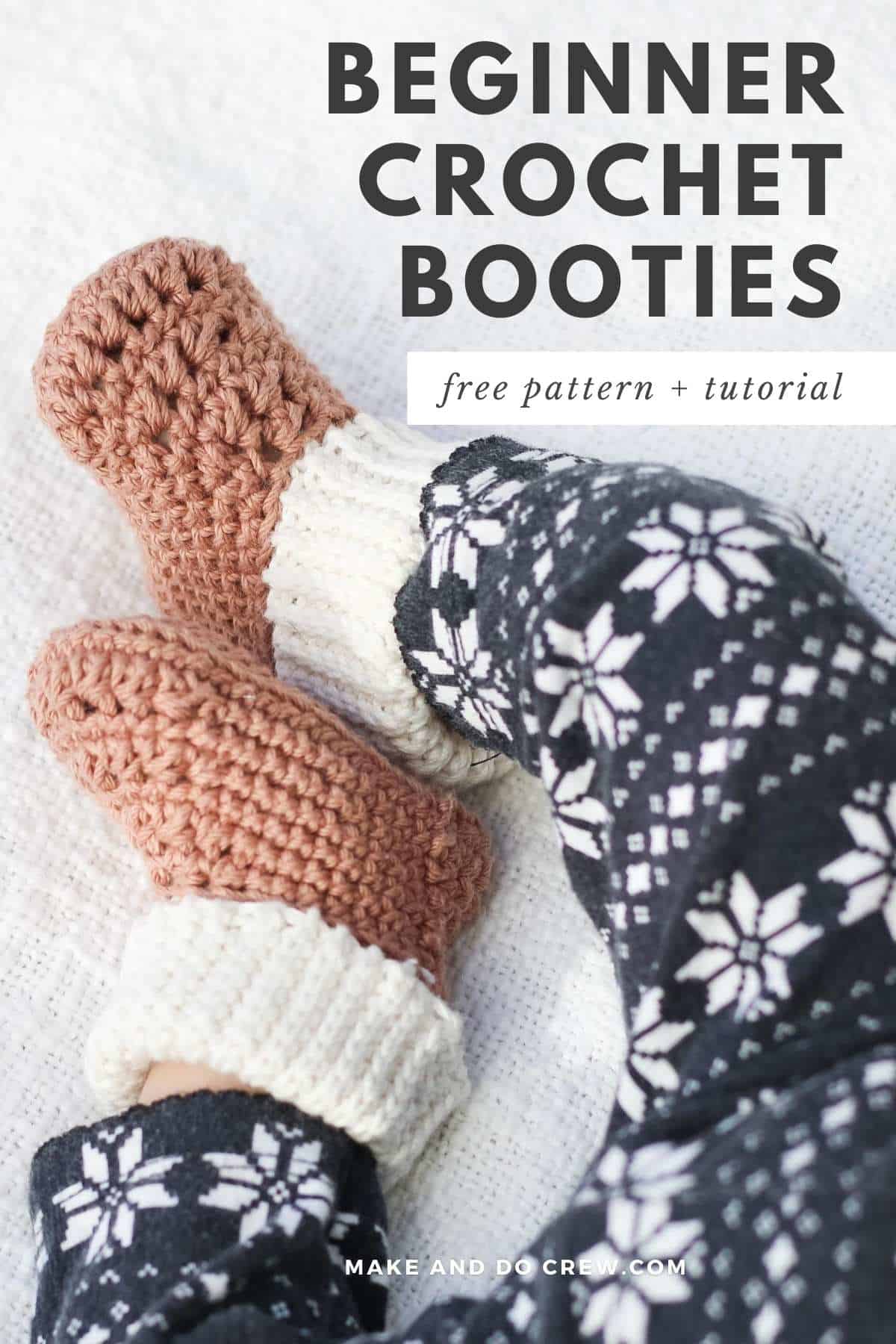Classic gender neutral crochet booties on a baby's feet.