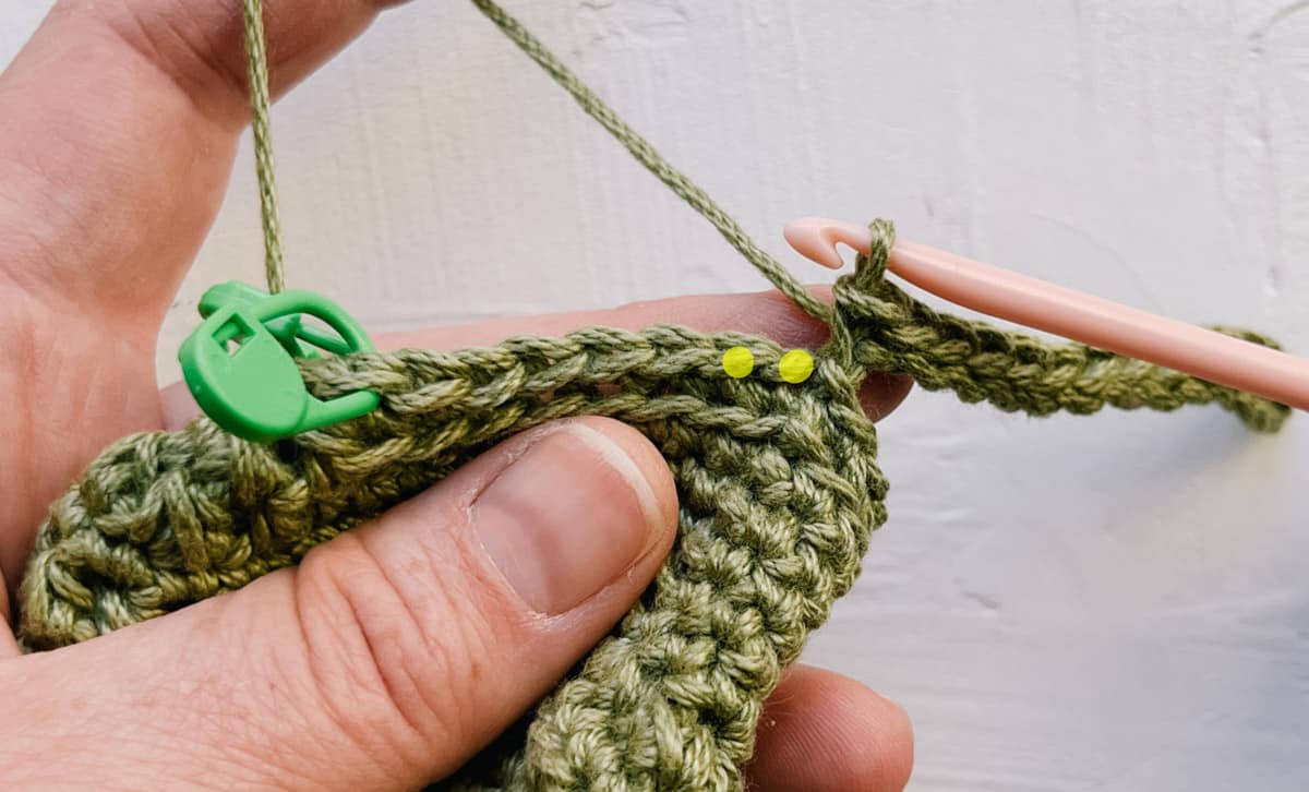 Crochet ribbing being attached to baby sock.