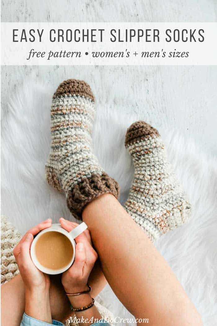 Chunky crochet slipper socks modeled by woman holding coffee.