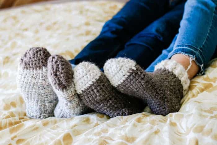Crochet slipper socks on feet.